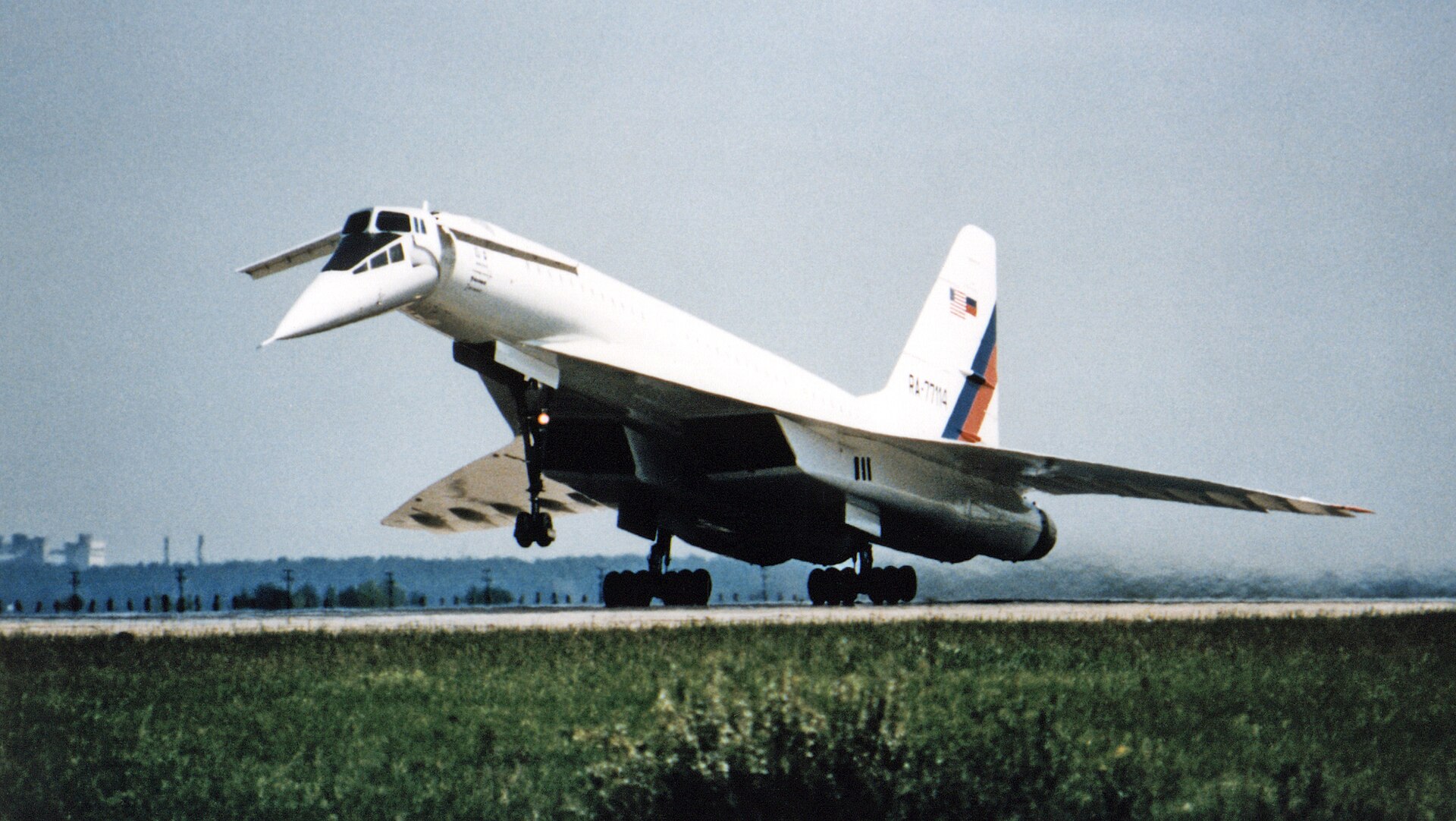With its nose drooped and canards extended, the Tupolev Tu-144LL supersonic flying laboratory lifts off from the Zhukovsky Air Development Center near Moscow, Russia on a 1997 test flight. NASA teamed with American and Russian aerospace industries for an extended period in a joint international research program featuring the Russian-built Tu-144LL supersonic aircraft. The object of the program was to develop technologies for a proposed future second-generation supersonic airliner to be developed in the 21st Century. The aircraft’s initial flight phase began in June 1996 and concluded in February 1998 after 19 research flights. A shorter follow-on program involving seven flights began in September 1998 and concluded in April 1999. All flights were conducted in Russia from Tupolev's facility at the Zhukovsky Air Development Center near Moscow. The centerpiece of the research program was the Tu 144LL, a first-generation Russian supersonic jetliner that was modified by its developer/builder, Tupolev ANTK (aviatsionnyy nauchno-tekhnicheskiy kompleks–roughly, aviation technical complex), into a flying laboratory for supersonic research. Using the Tu-144LL to conduct flight research experiments, researchers compared full-scale supersonic aircraft flight data with results from models in wind tunnels, computer-aided techniques, and other flight tests. The experiments provided unique aerodynamic, structures, acoustics, and operating environment data on supersonic passenger aircraft. Data collected from the research program was being used to develop the technology base for a proposed future American-built supersonic jetliner. Although actual development of such an advanced supersonic transport (SST) is currently on hold, commercial aviation experts estimate that a market for up to 500 such aircraft could develop by the third decade of the 21st Century. The Tu-144LL used in the NASA-sponsored research program was a "D" model with different engines than were used in production-model aircraft. Fifty experiments were proposed for the program and eight were selected, including six flight and two ground (engine) tests. The flight experiments included studies of the aircraft’s exterior surface, internal structure, engine temperatures, boundary-layer airflow, the wing’s ground-effect characteristics, interior and exterior noise, handling qualities in various flight profiles, and in-flight structural flexibility. The ground tests studied the effect of air inlet structures on airflow entering the engine and the effect on engine performance when supersonic shock waves rapidly change position in the engine air inlet. A second phase of testing further studied the original six in-flight experiments with additional instrumentation installed to assist in data acquisition and analysis. A new experiment aimed at measuring the in-flight deflections of the wing and fuselage was also conducted. American-supplied transducers and sensors were installed to measure nose boom pressures, angle of attack, and sideslip angles with increased accuracy. Two NASA pilots, Robert Rivers of Langley Research Center, Hampton, Virginia, and Gordon Fullerton from Dryden Flight Research Center, Edwards, California, assessed the aircraft’s handling at subsonic and supersonic speeds during three flight tests in September 1998. The program concluded after four more data-collection flights in the spring of 1999. The Tu-144LL model had new Kuznetsov NK-321 turbofan engines rated at more than 55,000 pounds of thrust in full afterburner. The aircraft is 215 feet, 6 inches long and 42 feet, 2 inches high with a wingspan of 94 feet, 6 inches. The aircraft is constructed mostly of light aluminum alloy with titanium and stainless steel on the leading edges, elevons, rudder, and the under-surface of the rear fuselage.